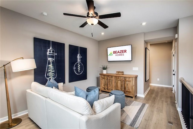 7505 Woolf Way, Cumming, GA 30028 - living room with a ceiling fan, light wood finished floors, baseboards, and recessed lighting