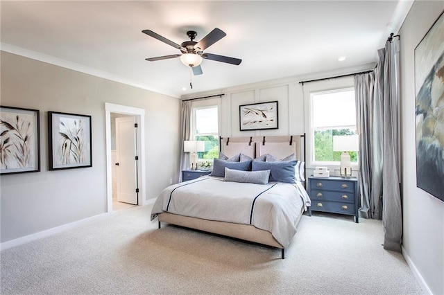 7505 Woolf Way, Cumming, GA 30028 - bedroom with light colored carpet, baseboards, crown molding, and a ceiling fan