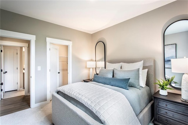 7505 Woolf Way, Cumming, GA 30028 - carpeted bedroom with baseboards and a spacious closet