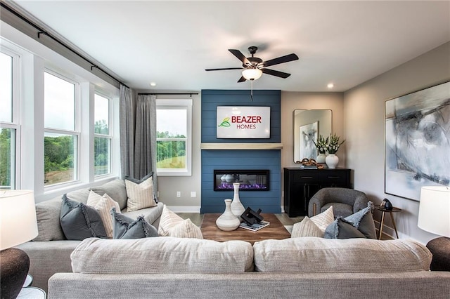 7505 Woolf Way, Cumming, GA 30028 - living area featuring a ceiling fan, a fireplace, baseboards, and recessed lighting