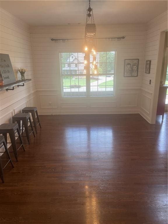 501 Rabun Ct, Canton, GA 30115 - unfurnished dining area with dark wood-type flooring and a decorative wall