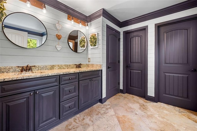 501 Rabun Ct, Canton, GA 30115 - bathroom featuring double vanity, crown molding, and wood walls