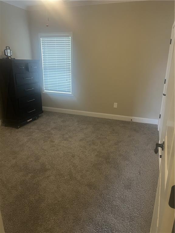 501 Rabun Ct, Canton, GA 30115 - unfurnished bedroom featuring carpet flooring