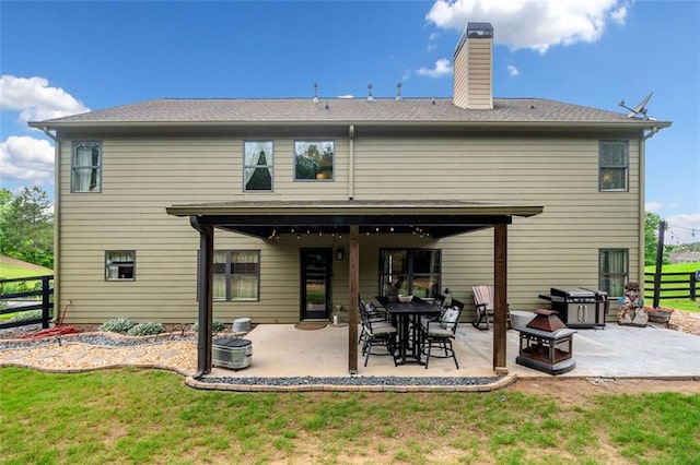 501 Rabun Ct, Canton, GA 30115 - back of house with a patio area and a chimney