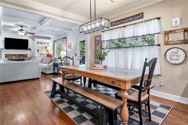 501 Rabun Ct, Canton, GA 30115 - dining space with ceiling fan, wood finished floors, crown molding, baseboards, and a fireplace