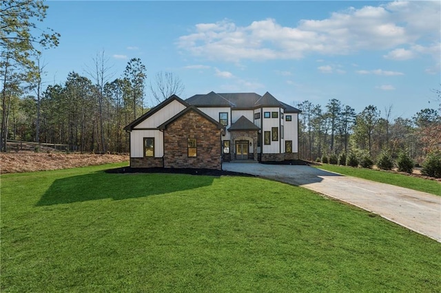 6449 Snelling Mill Rd, Flowery Branch, GA 30542 - view of front facade featuring driveway, stone siding, and a front yard