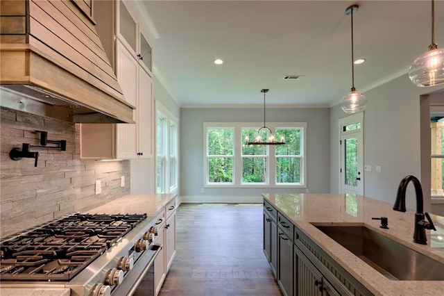 6449 Snelling Mill Rd, Flowery Branch, GA 30542 - kitchen featuring a sink, stainless steel stove, premium range hood, light stone counters, and crown molding