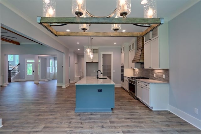 6449 Snelling Mill Rd, Flowery Branch, GA 30542 - kitchen featuring appliances with stainless steel finishes, a sink, baseboards, open floor plan, and white cabinets