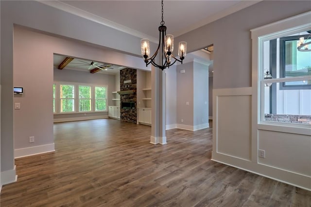 6449 Snelling Mill Rd, Flowery Branch, GA 30542 - unfurnished dining area featuring a chandelier, a ceiling fan, dark wood-type flooring, baseboards, and built in features