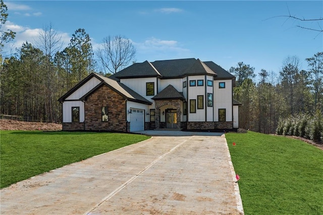 6449 Snelling Mill Rd, Flowery Branch, GA 30542 - view of front of property with stone siding, concrete driveway, a front lawn, and a garage