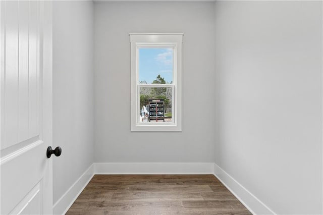 empty room with wood-type flooring