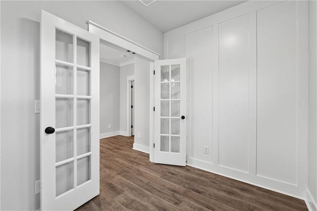 unfurnished room with dark hardwood / wood-style flooring and french doors