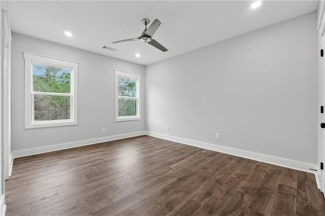 unfurnished room with dark hardwood / wood-style floors and ceiling fan