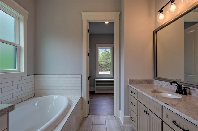 6449 Snelling Mill Rd, Flowery Branch, GA 30542 - full bathroom with vanity, a bath, and tile patterned flooring
