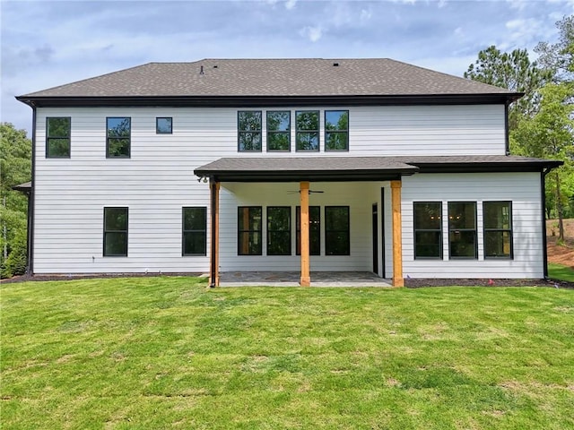 6449 Snelling Mill Rd, Flowery Branch, GA 30542 - rear view of property featuring a ceiling fan, a patio area, a lawn, and roof with shingles