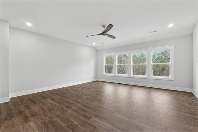 spare room featuring ceiling fan and dark hardwood / wood-style flooring