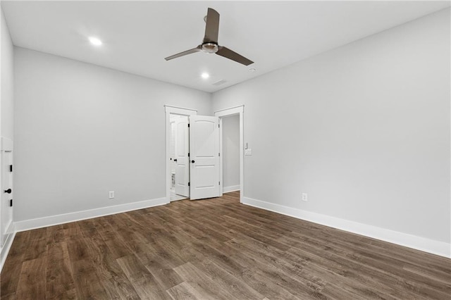 unfurnished bedroom with dark hardwood / wood-style floors and ceiling fan