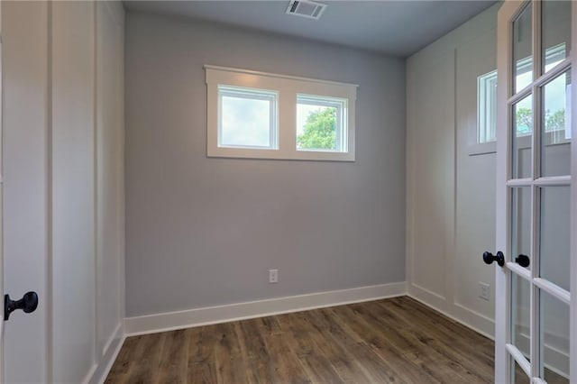 6449 Snelling Mill Rd, Flowery Branch, GA 30542 - spare room featuring dark wood finished floors and baseboards