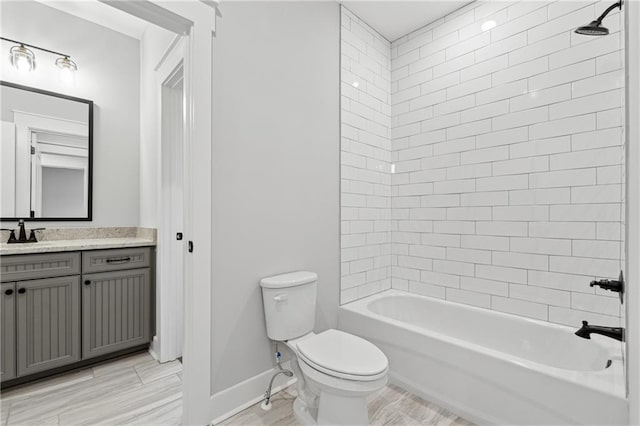 full bathroom with vanity, toilet, and tiled shower / bath