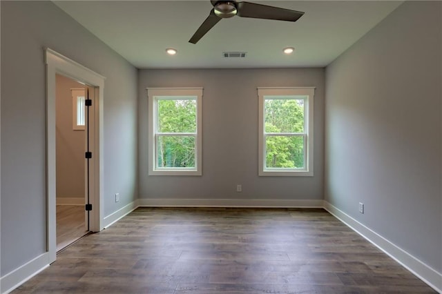 6449 Snelling Mill Rd, Flowery Branch, GA 30542 - spare room featuring plenty of natural light, a ceiling fan, dark wood-style floors, baseboards, and recessed lighting