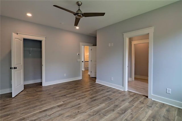 6449 Snelling Mill Rd, Flowery Branch, GA 30542 - unfurnished bedroom featuring wood finished floors, baseboards, recessed lighting, a closet, and ceiling fan