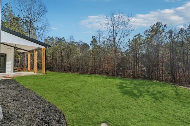 view of yard featuring ceiling fan