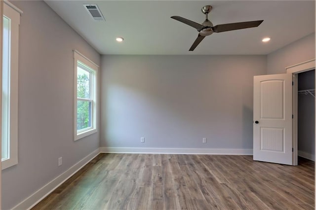 6449 Snelling Mill Rd, Flowery Branch, GA 30542 - unfurnished bedroom featuring baseboards, wood finished floors, and recessed lighting