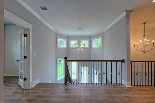 6449 Snelling Mill Rd, Flowery Branch, GA 30542 - spare room featuring a chandelier, crown molding, wood finished floors, and baseboards