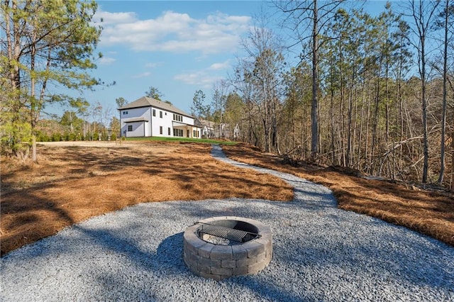 view of yard featuring an outdoor fire pit