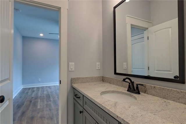 6449 Snelling Mill Rd, Flowery Branch, GA 30542 - bathroom with vanity, wood finished floors, and recessed lighting