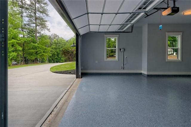 6449 Snelling Mill Rd, Flowery Branch, GA 30542 - garage featuring a garage door opener