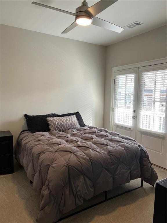 carpeted bedroom with access to outside and ceiling fan