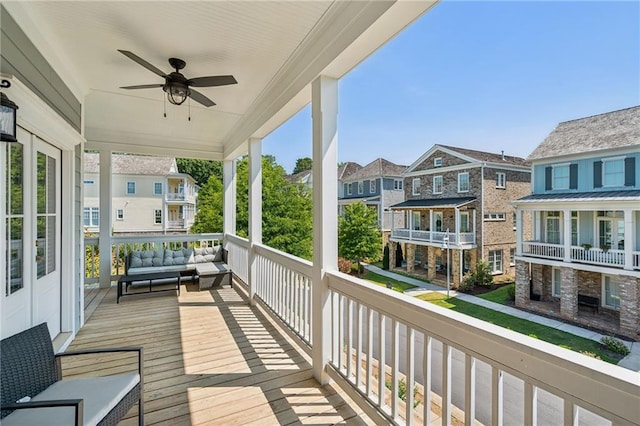 balcony featuring outdoor lounge area and ceiling fan