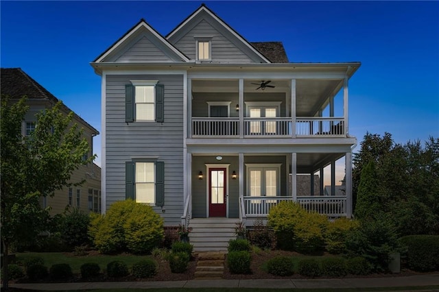 view of front facade featuring a balcony, covered porch, and ceiling fan