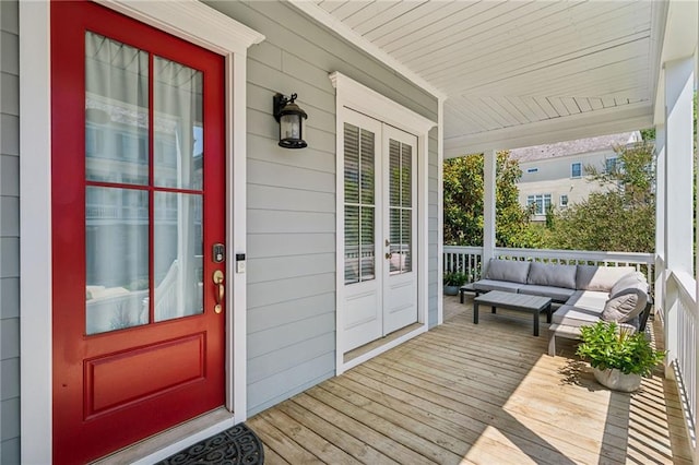 view of exterior entry with a porch