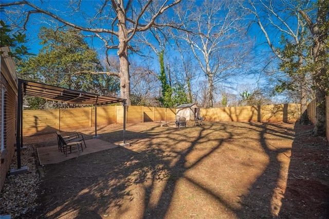 view of yard featuring a patio area and a fenced backyard