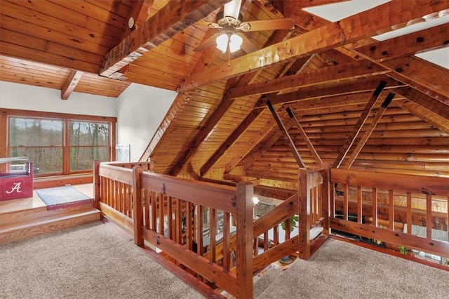 carpeted bedroom with vaulted ceiling with beams, log walls, and wooden ceiling