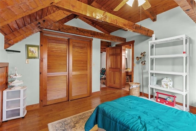 bedroom featuring vaulted ceiling with beams, ceiling fan, wood-type flooring, and wooden ceiling