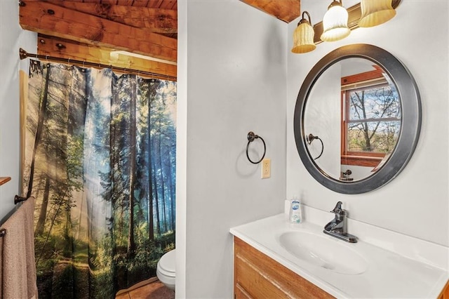 bathroom with a shower with curtain, vanity, toilet, and wood ceiling