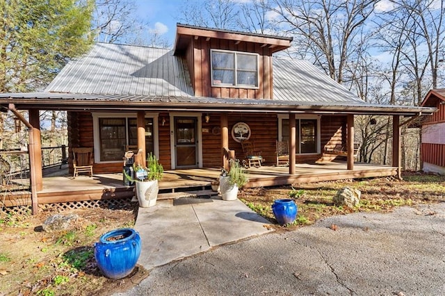 cabin featuring a porch