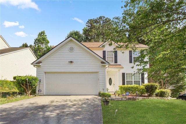 view of front of property featuring a garage and a front yard