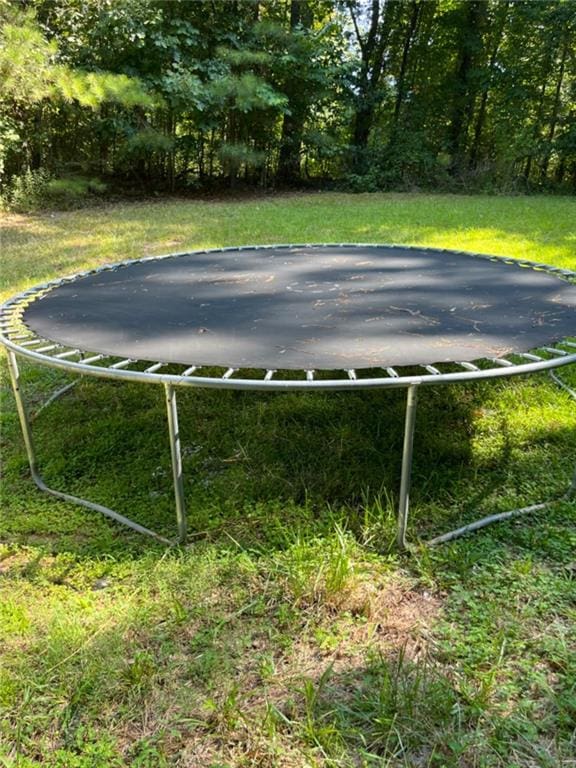 view of yard featuring a trampoline