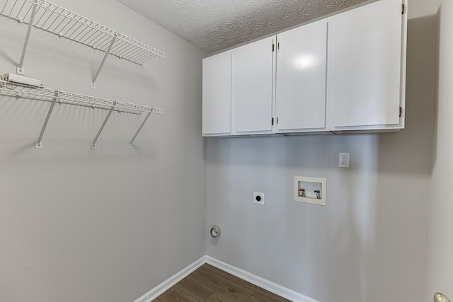 laundry room with dark wood-type flooring, cabinet space, baseboards, hookup for an electric dryer, and hookup for a washing machine