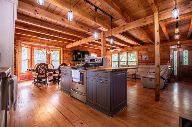 kitchen with track lighting, beam ceiling, gray cabinets, stainless steel electric stove, and wooden ceiling
