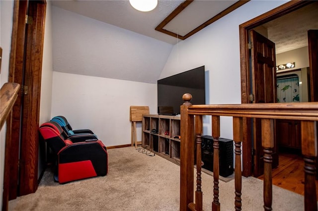 living area with baseboards, carpet flooring, and lofted ceiling