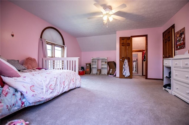 bedroom with a ceiling fan, light colored carpet, and vaulted ceiling