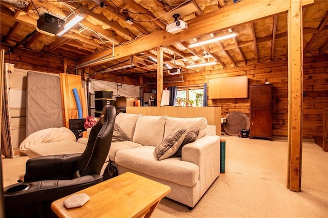 basement with wooden walls and light colored carpet