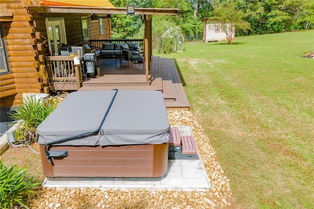 exterior space featuring a hot tub, a deck, and an outdoor hangout area
