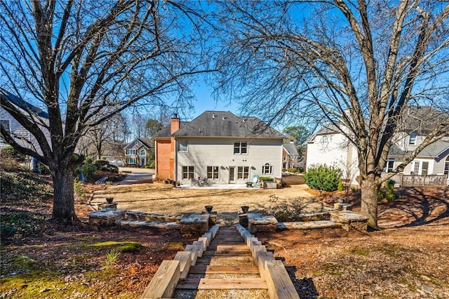 rear view of house featuring a patio area