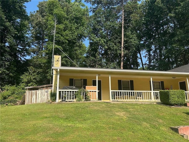 2128 Valley Oaks Dr, Smyrna, GA 30080 - view of front of home featuring a porch, a front yard, and a chimney